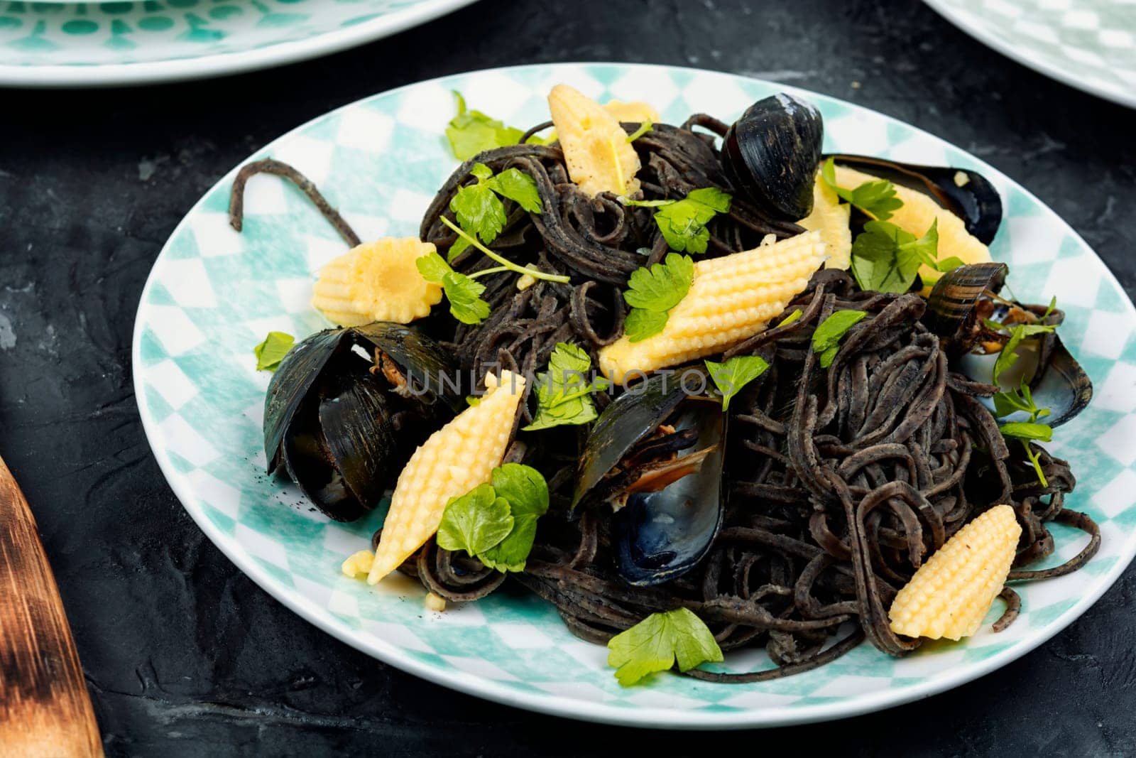 Vegan black bean pasta with clams, mussels. Mediterranean pasta vongole.