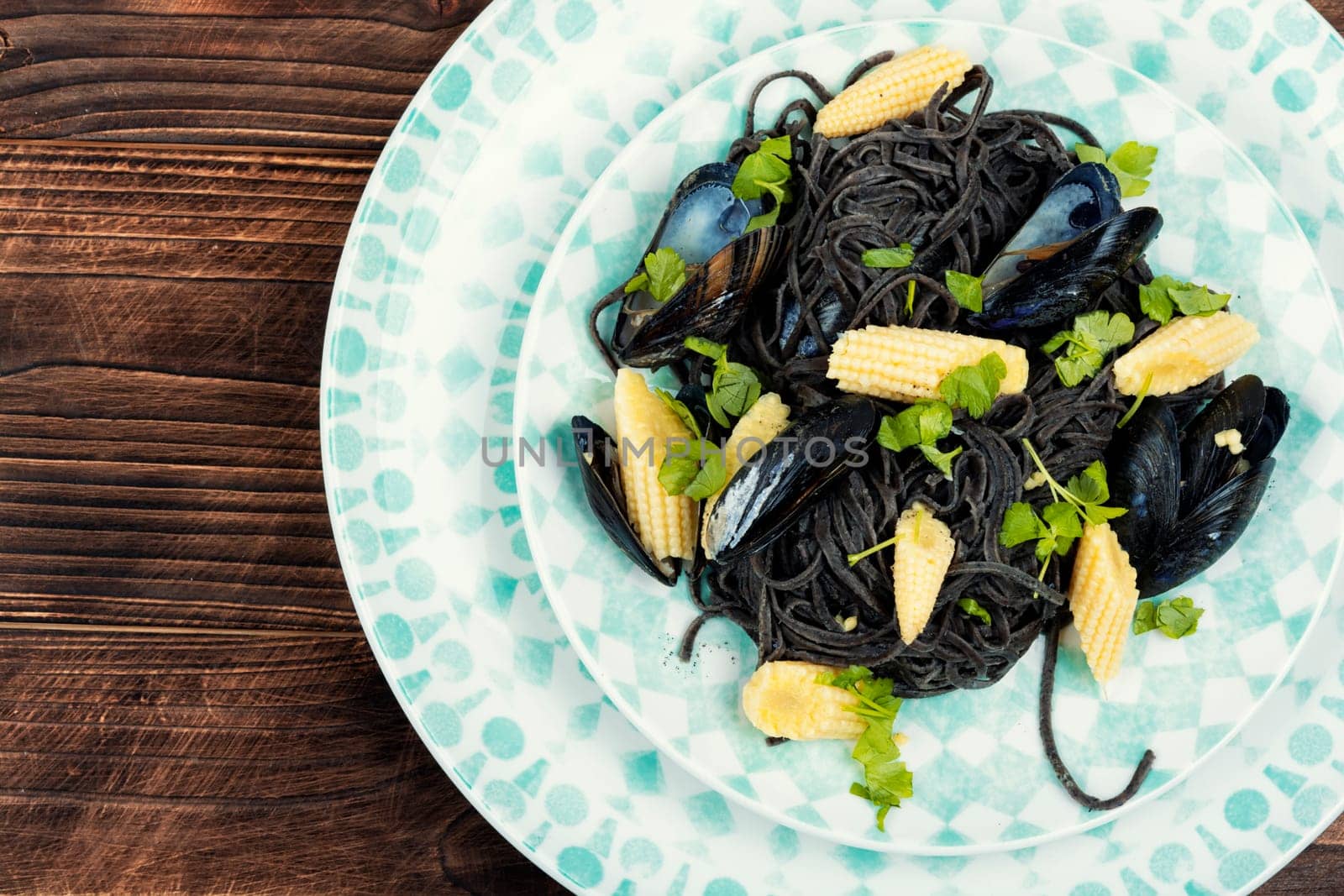 Vegan black bean pasta with clams, mussels. Mediterranean pasta vongole.