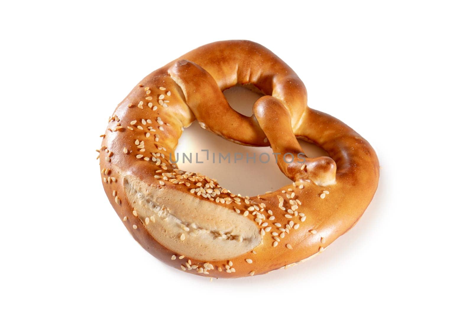 Gourmet pretzel with sesame, a tempting golden-brown twist. German culinary allure on a white backdrop, capturing the delicious and savory essence in this enticing image
