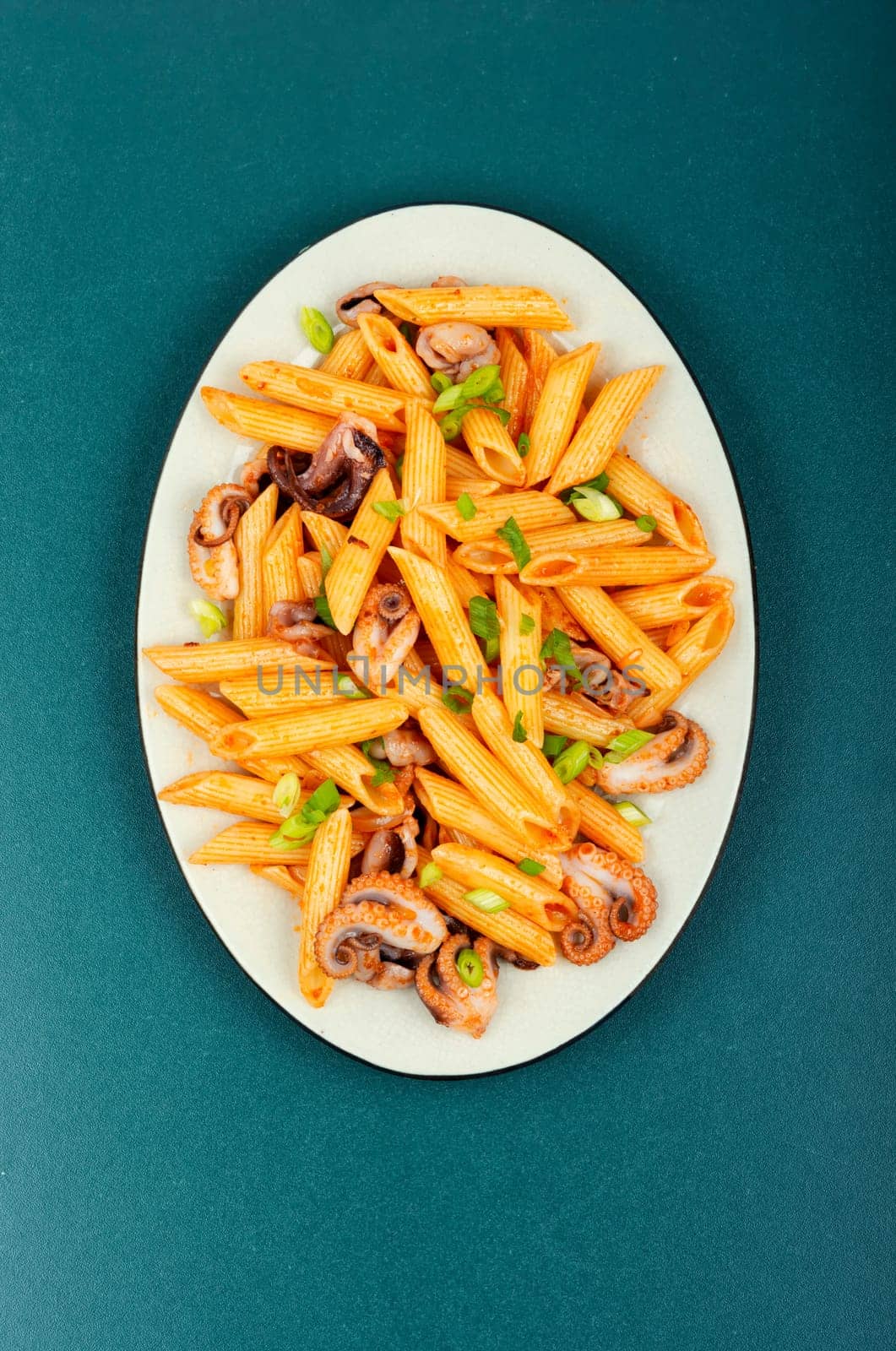 Delicious macaroni or pasta with octopus. Macaroni with seafood. American appetizer.