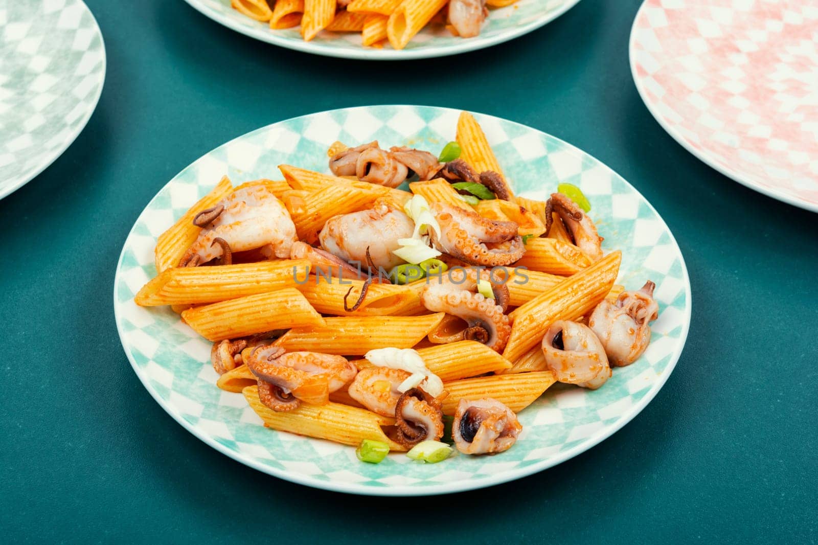 Delicious macaroni or pasta with octopus. Macaroni with seafood. American appetizer.