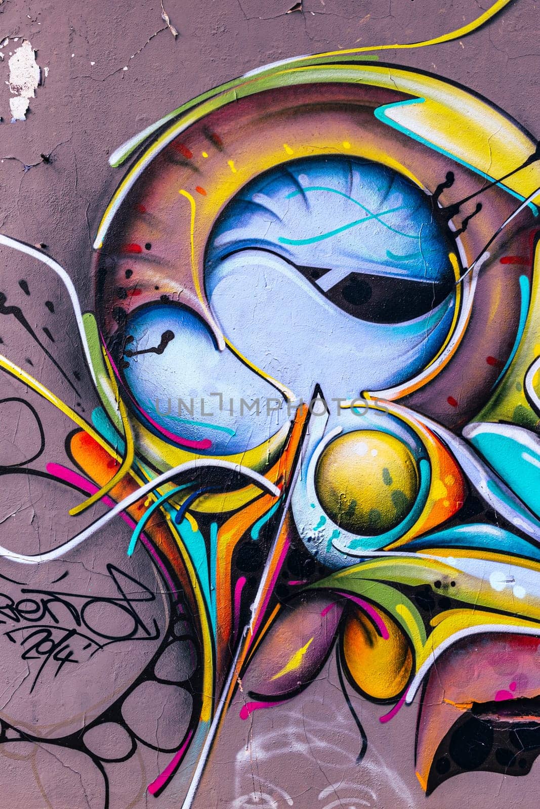 Bordeaux, France - september 16 2016 : Graffiti detail vertically framed on the wall, abstract background