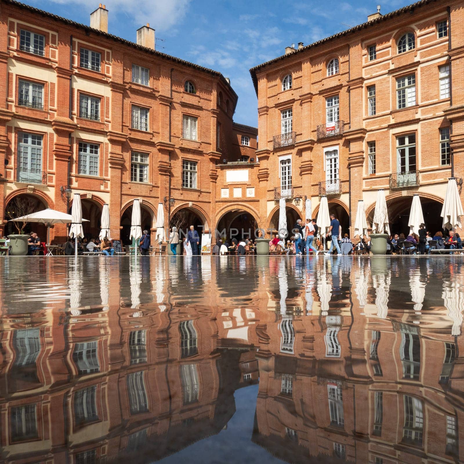Montauban, France - march 26 2023: Place Nationale and its central pond. Photography taken in Montauban, France