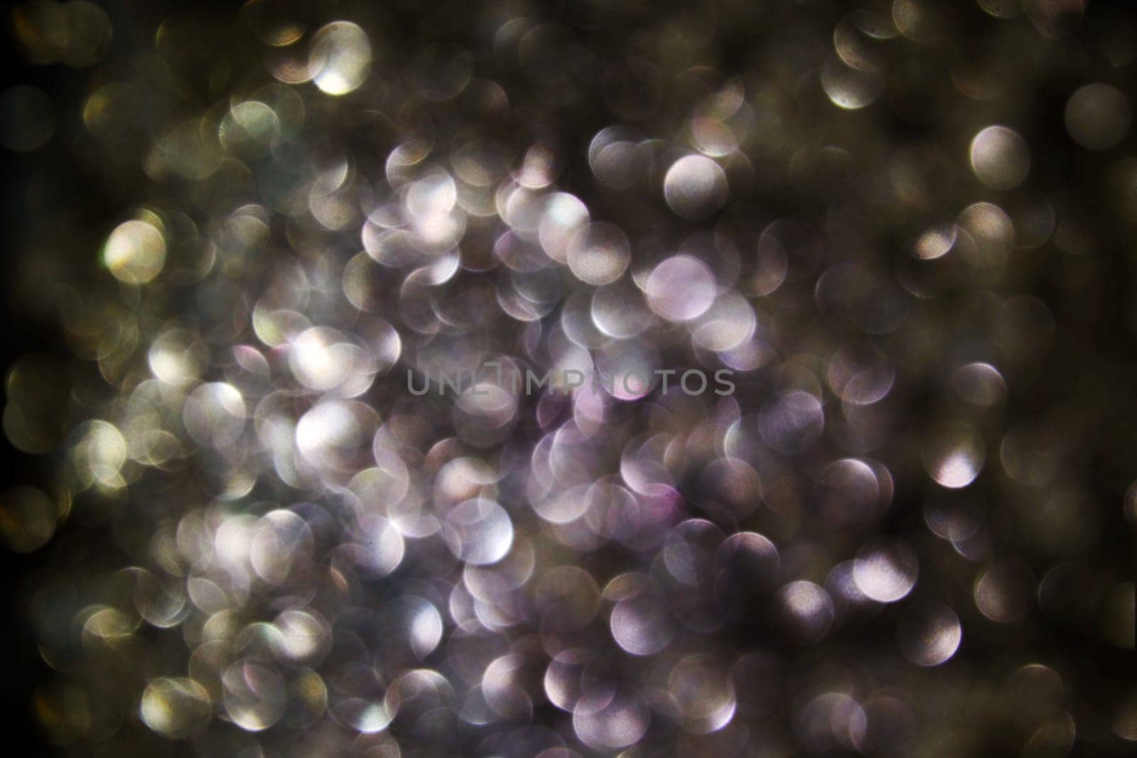 Black background with many purple and gold light points