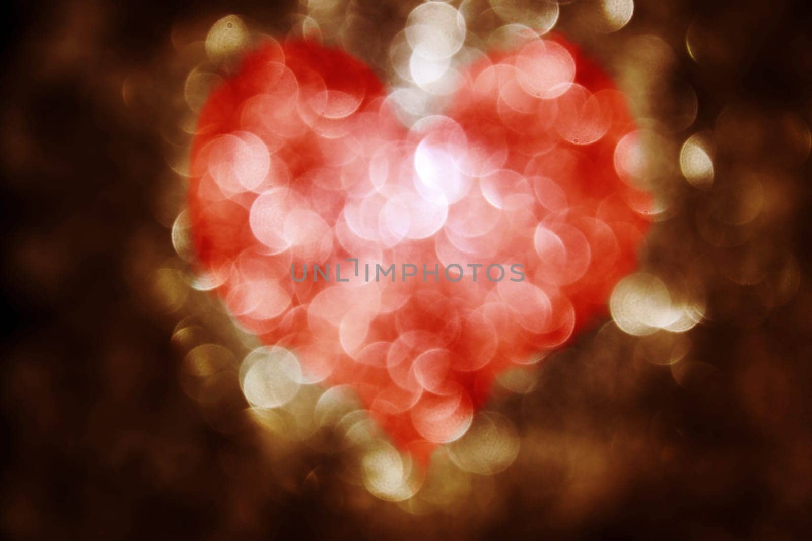 Glittering background with dots of light and a large red heart