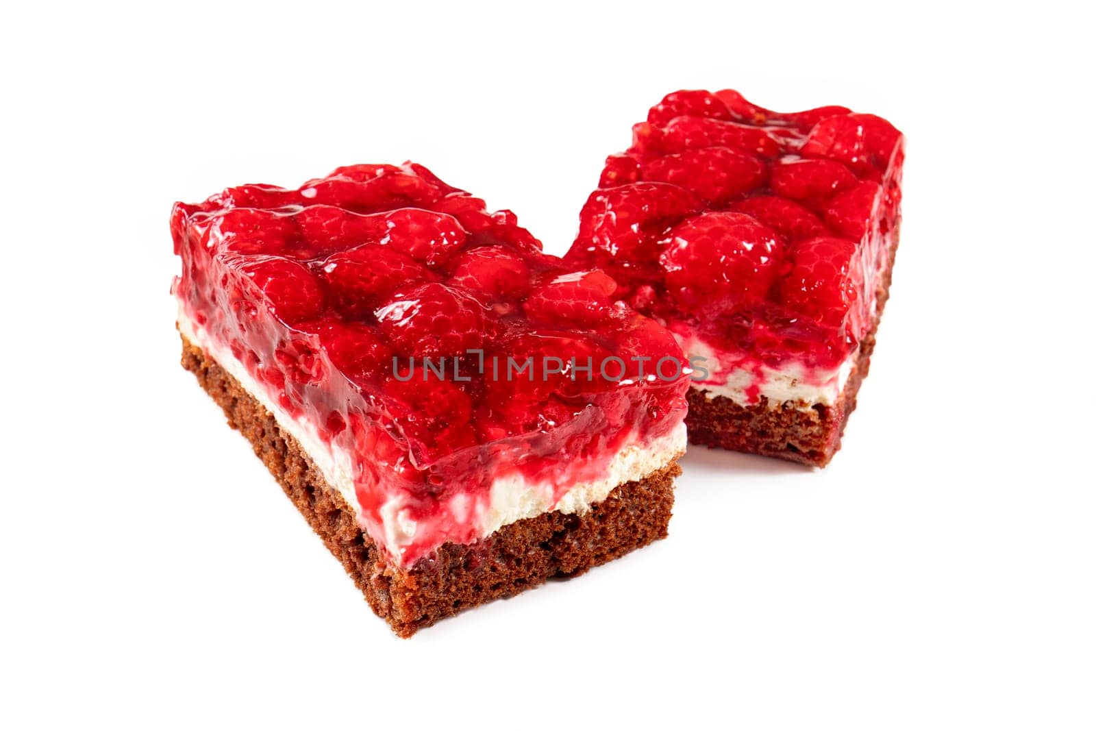 Two raspberry tarts, freshly baked and glistening with a generous layer of raspberry jam. The tarts are generously filled with plump raspberries, creating a mouth-watering burst of flavor and color. The tarts are displayed on a white background, making them a tempting treat.