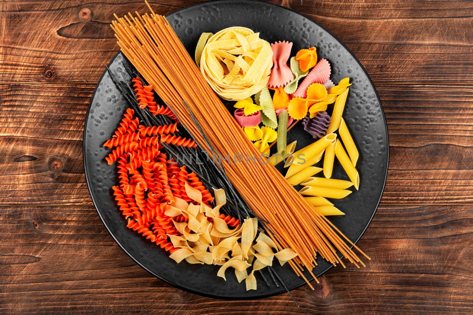 Various kinds of uncooked pasta, noodles and spaghetti. Macro.