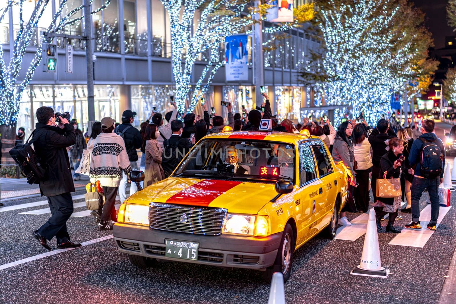 TOKYO/JAPAN - November 21 2023:crowds photographing Christmas lights in the roppongi district