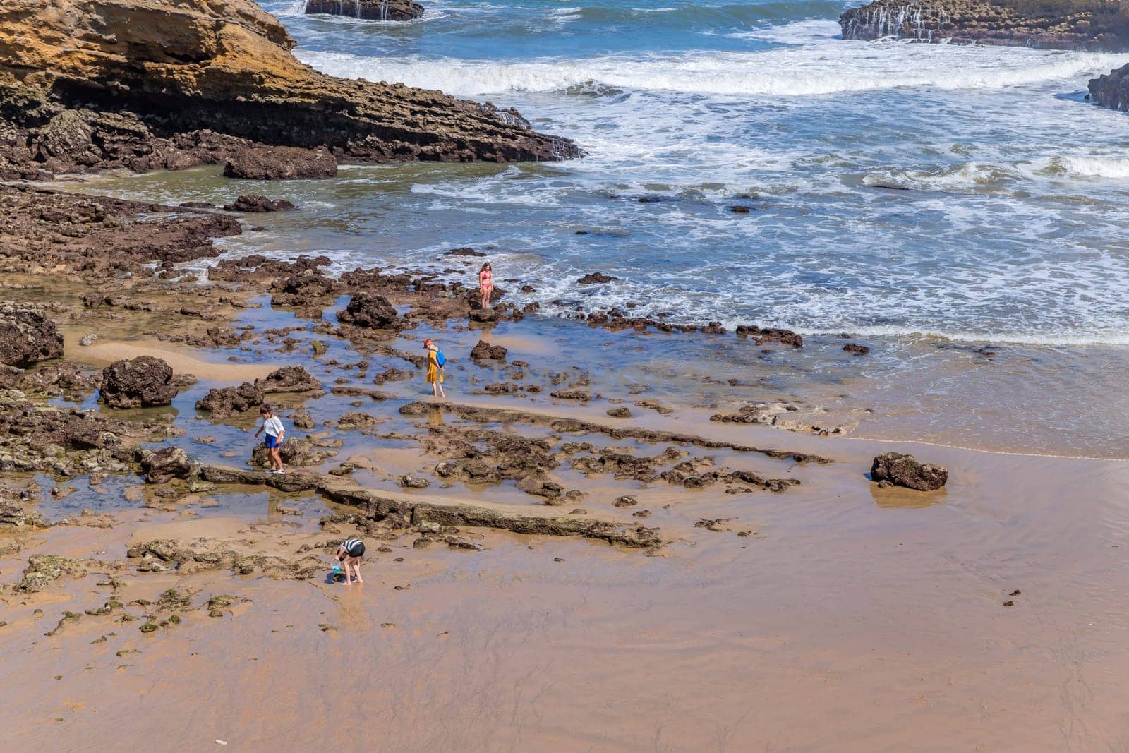Biarritz, France, July 03, 2023: People at the beach Grande Plage (Big beach) in the French resort town of Biarritz.