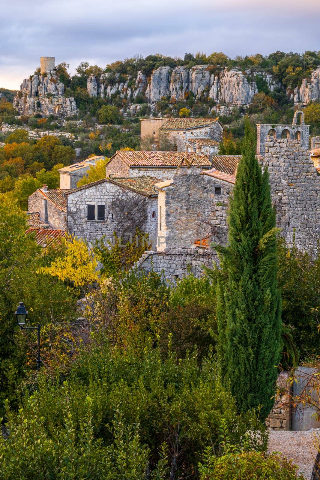 The medieval village of Balazuc over Ardèche river. Vertical photography taken in France