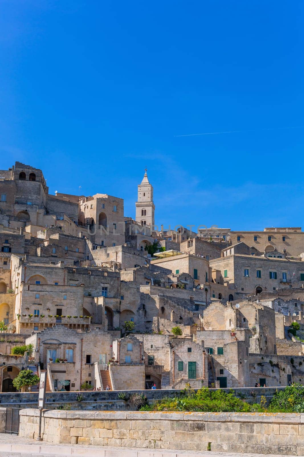 Matera, Italy - 6 May 2023: Old town of Matera (Sassi di Matera), Basilicata, southern Italy. Prehistoric cave dwellings