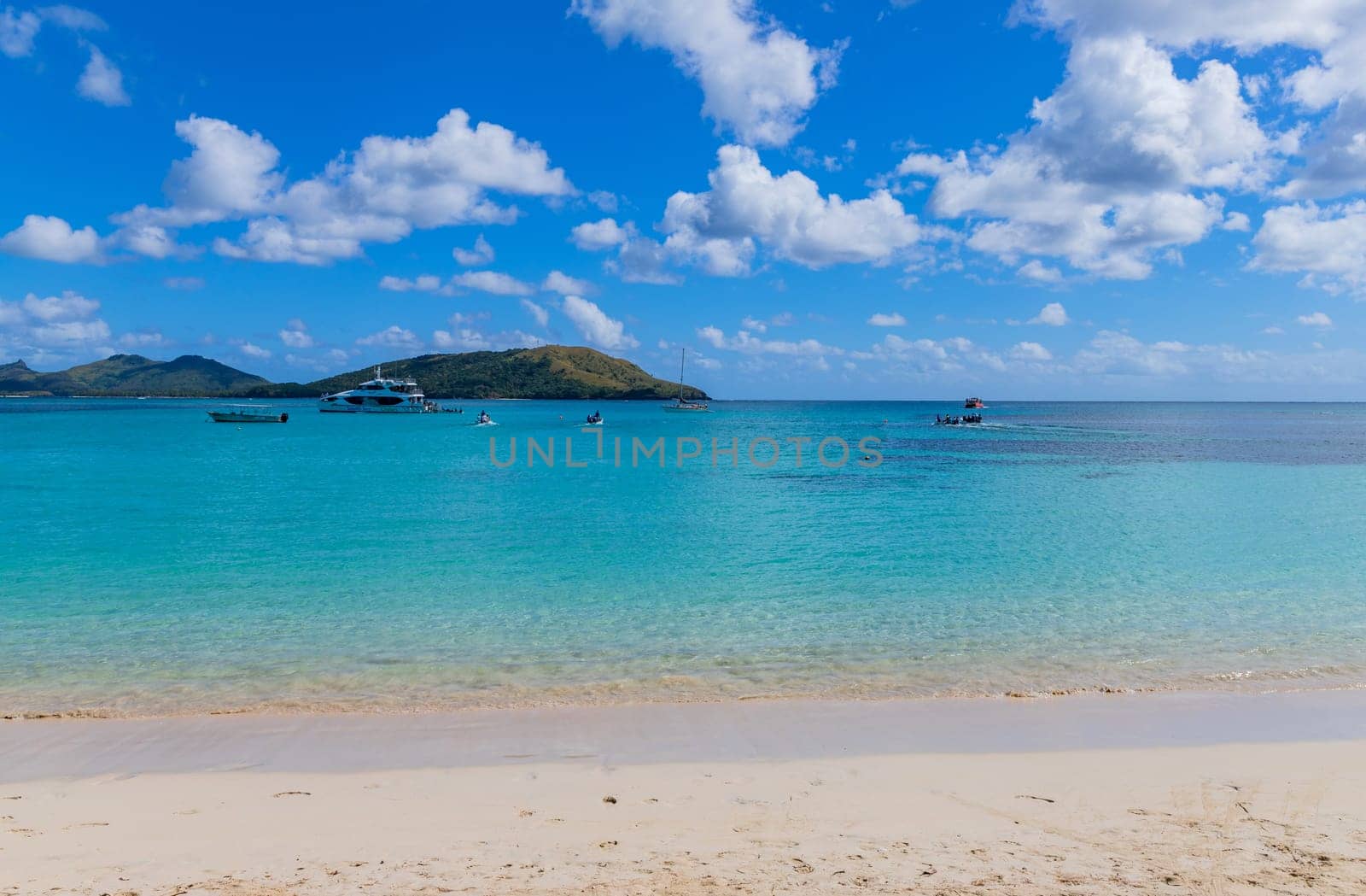 Nacula, Fiji: 26 May 2023: Tourist boats at the tropical sandy beach of Nacula island, Yasawa islands, Fiji, South Pacific Islands, Pacific