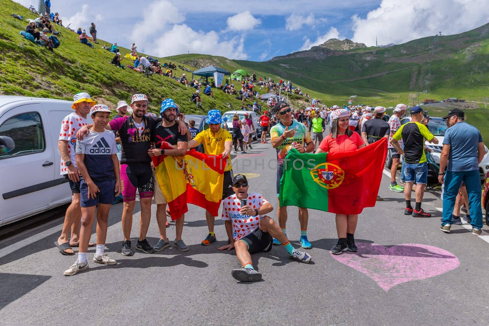 Col du Tourmalet, France - July 06 2023: Cycling fans waiting for the buch at the top of the Col du Tourmalet in Pyerenees mountains during the stage 6 of Le Tour de France 2023