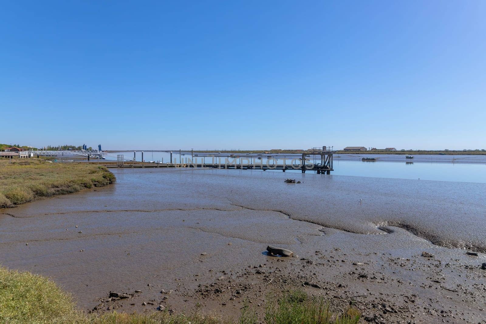 Mudflats at the estuary of the Tagus river near the Vasco da Gama bridge Lisbon, Portugal.