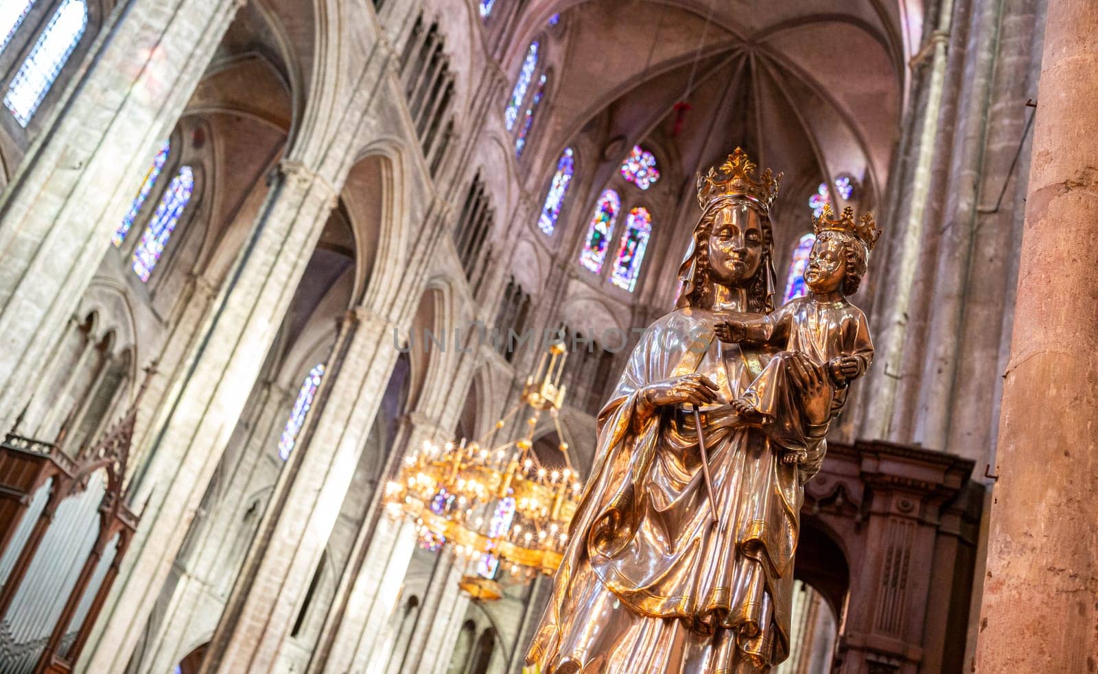 Bourges, France - october 21, 2017: Virgin and Child sculpture in Saint-Etienne de Bourges Cathedral, work of the goldsmith Artstide Poussielgue-Rusand (around 1870-1880). Partly gilded silver, silvered and gilded bronze.