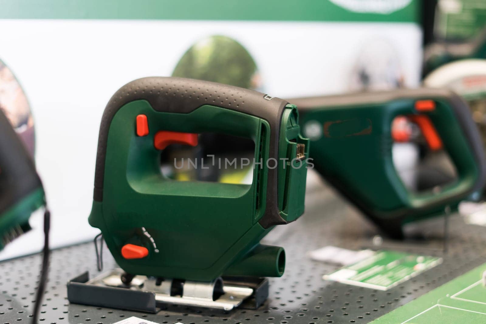 Power tools, drills and hammers of various manufacturers are sold in hardware store.
