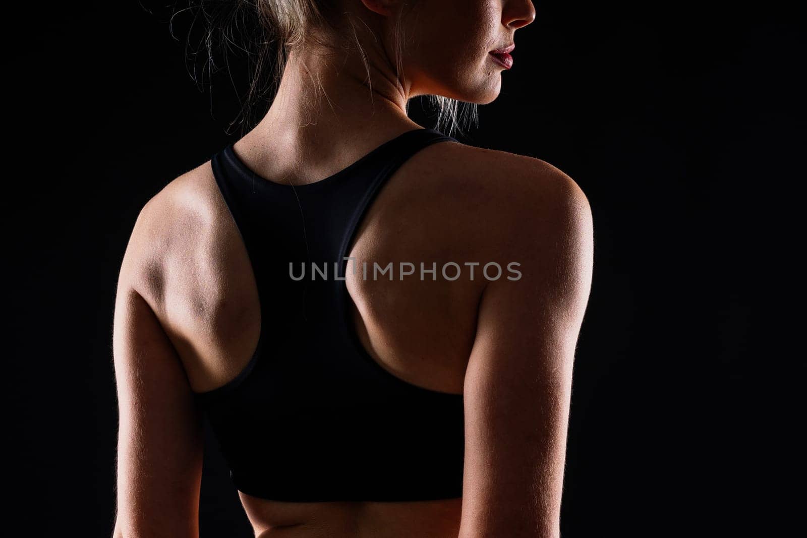 Young strong sporty athletic fitness trainer instructor woman. Workout sport conception