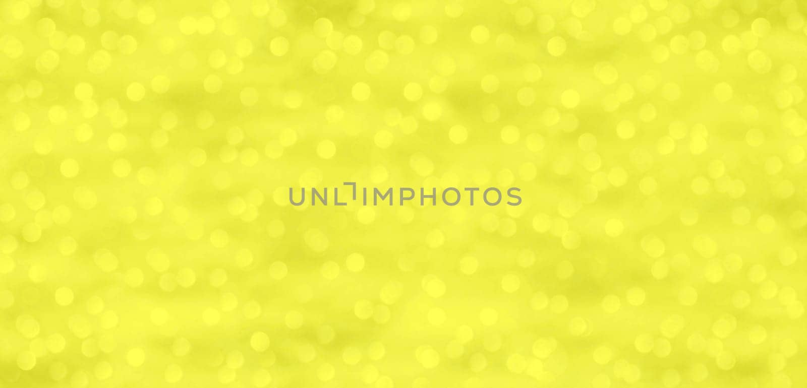 Yellow and gold background with dots of light