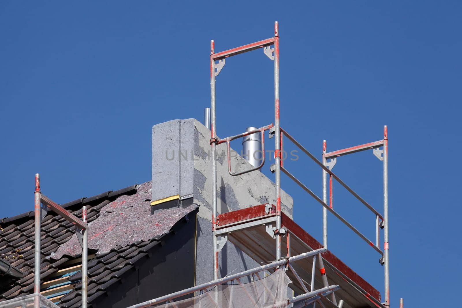 Scaffolding with chimney and roof on an old building, Bremen, Germany
