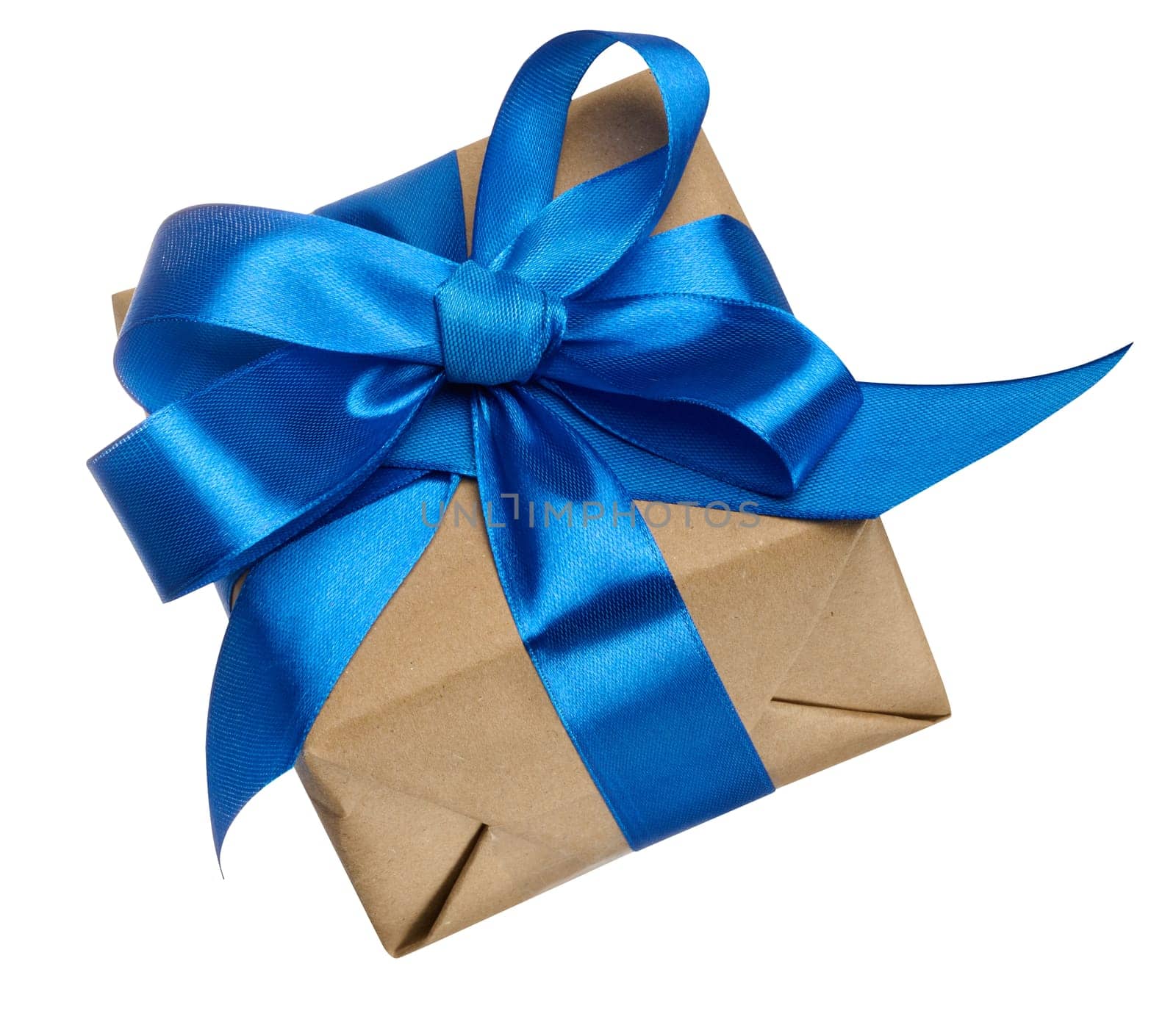 Box is wrapped in brown paper and blue ribbon on a white isolated background