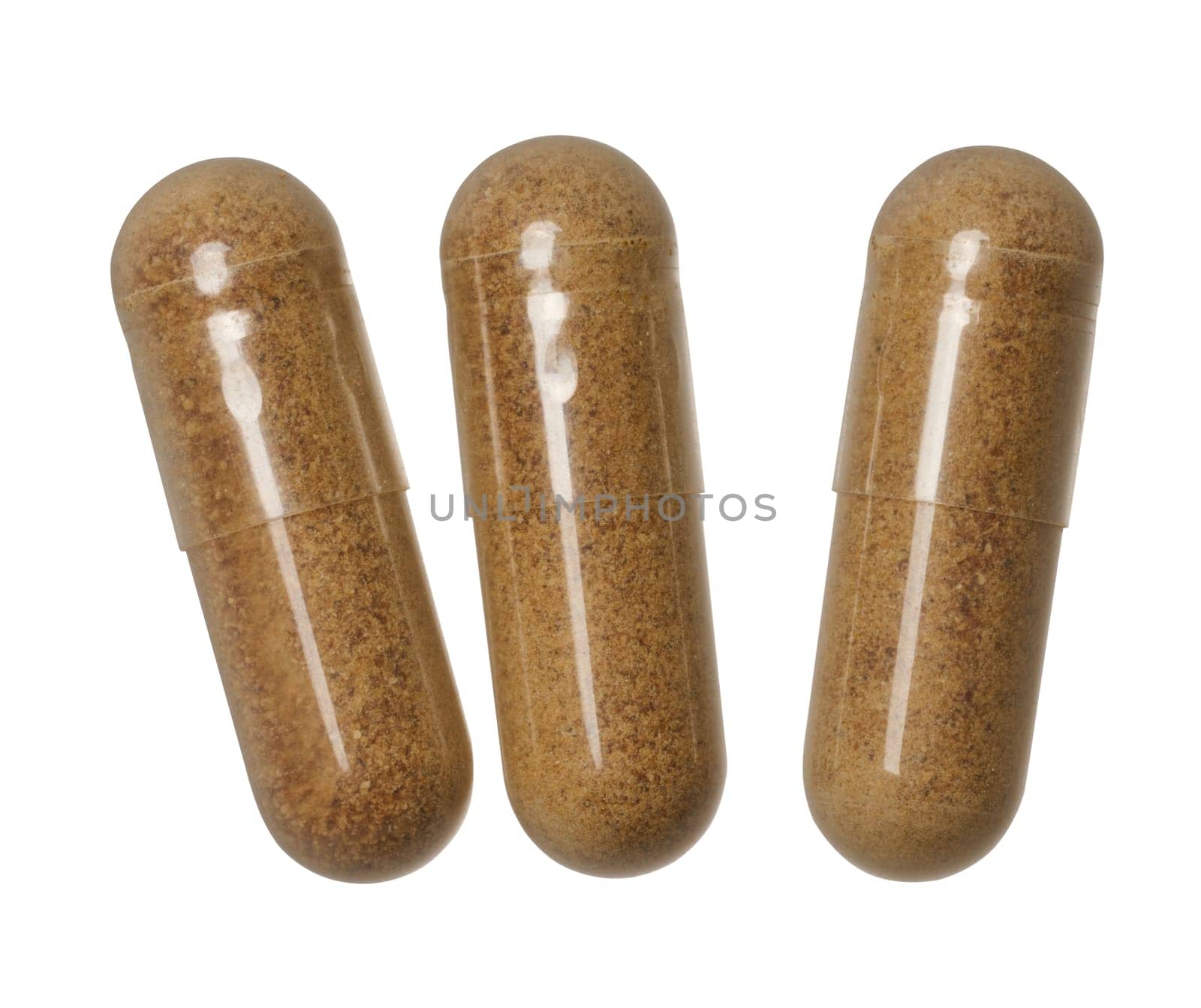 Transparent capsule with brown powder on isolated background, medical drug. Top view