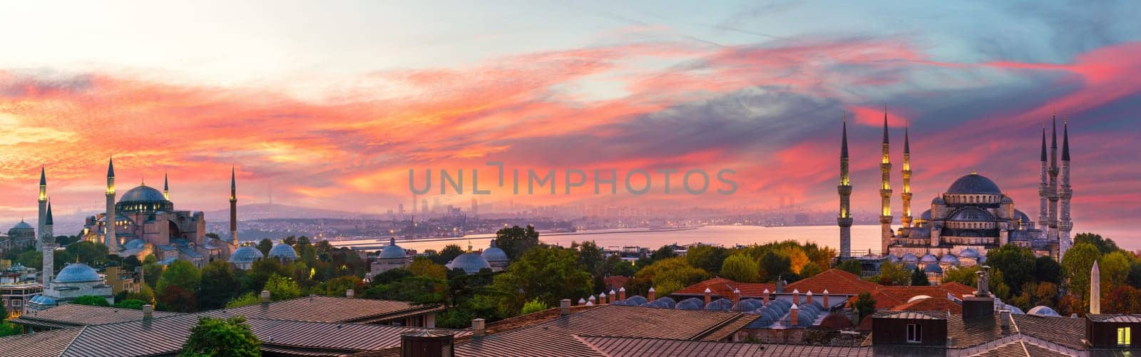 Sunset panorama over Hagia Sophia and the Blue Mosque of Istanbul, view on the city skyline, Turkey.