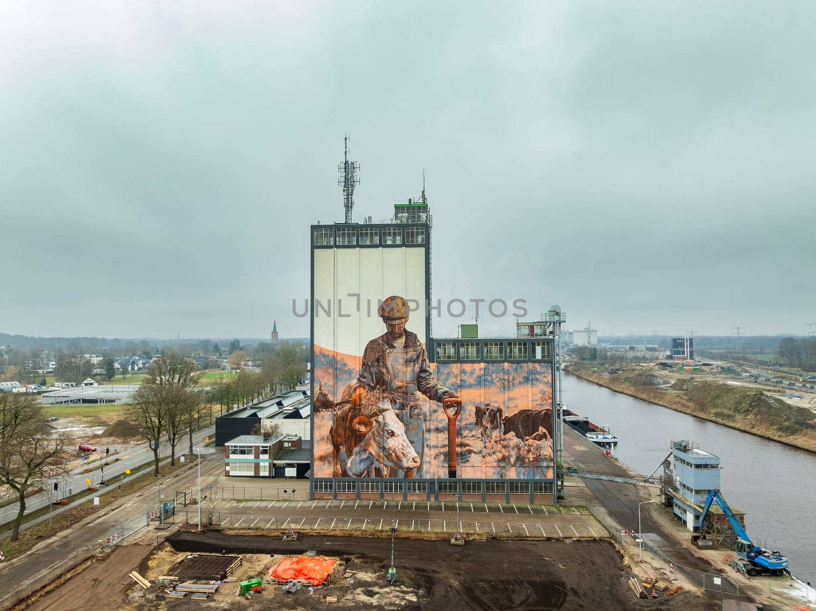 LOCHEM, NETHERLANDS - JANUARY 20, 2024: Artwork on a large building as part of the Achterhoek  Silo Art Tour, whereby barns, silos and other agricultural buildings have been transformed into works of art.