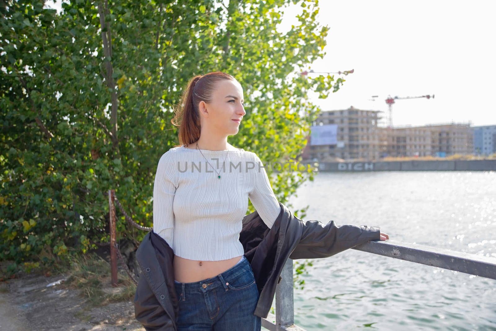 young woman with ponytail enjoying sun