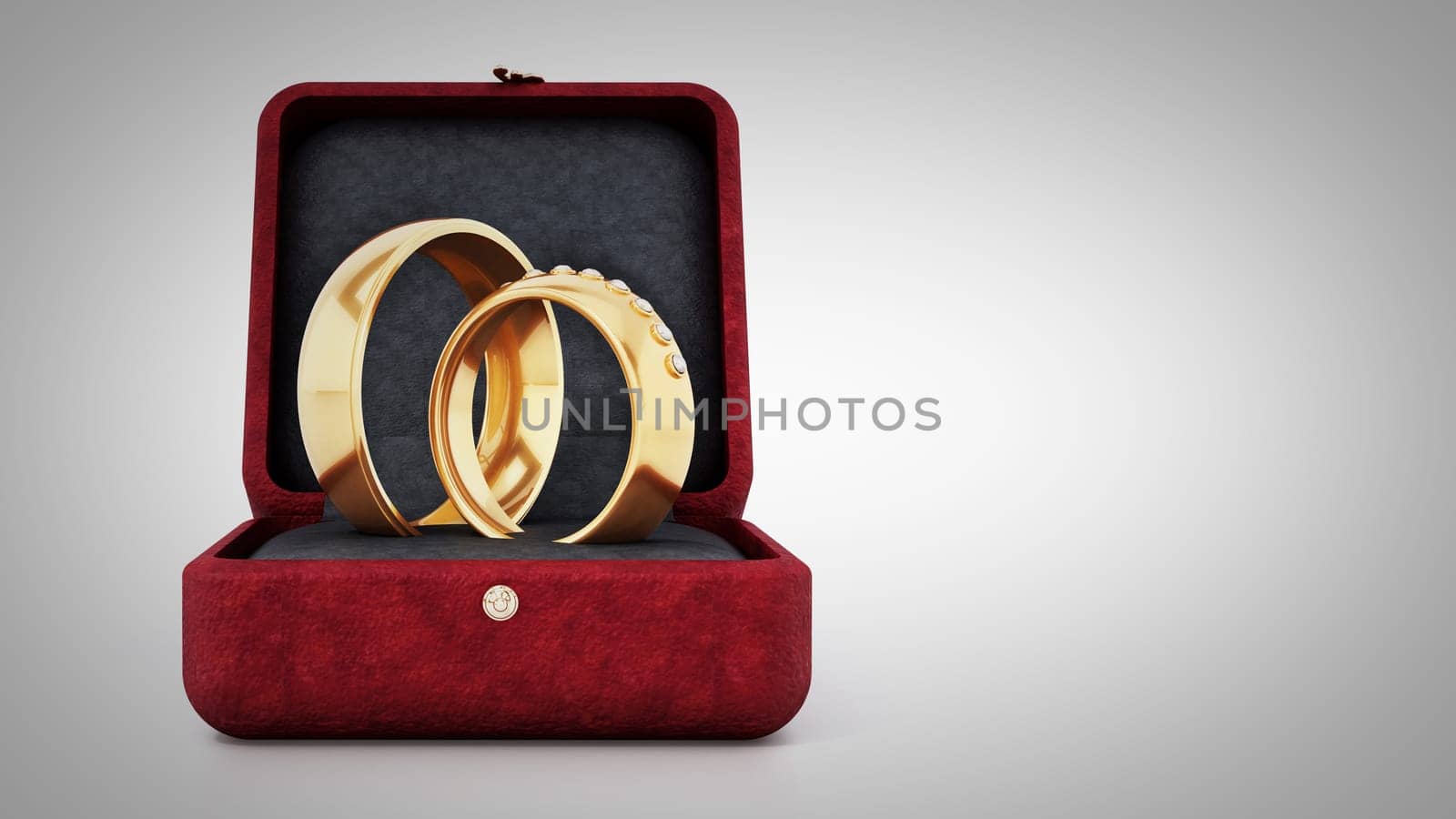 Wedding rings inside red velvet ringbox. 3D illustration.