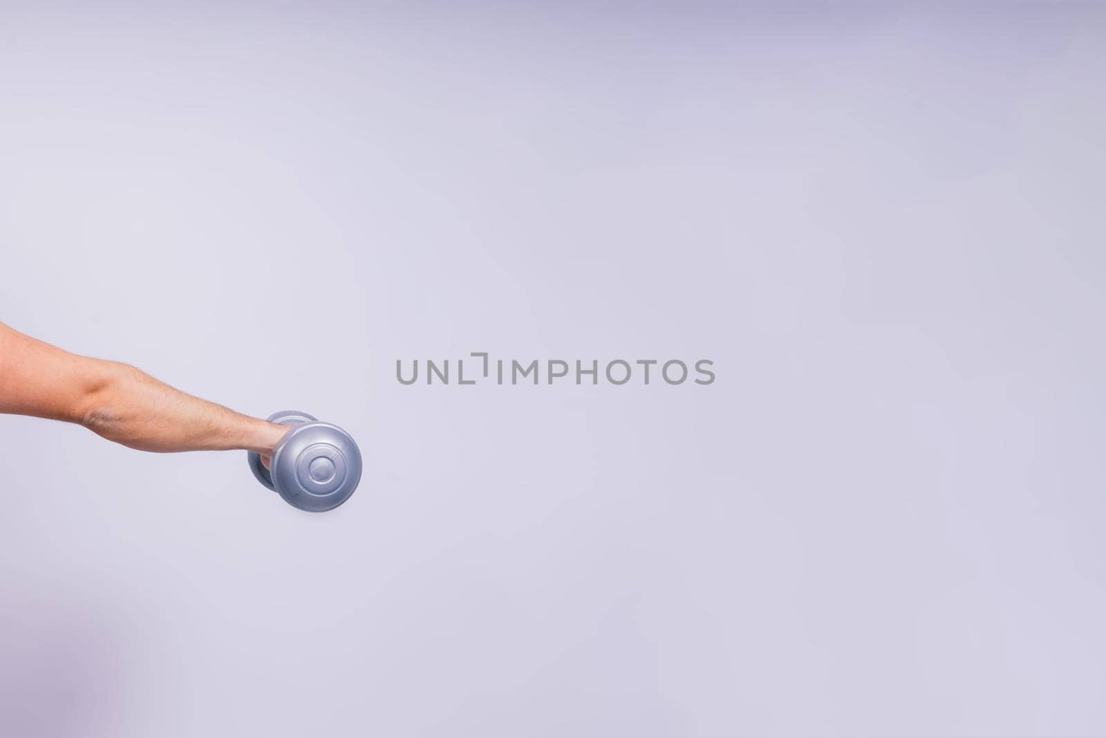 Man, dumbbell and exercise in a studio for fitness, wellness and healthy body with workout training.