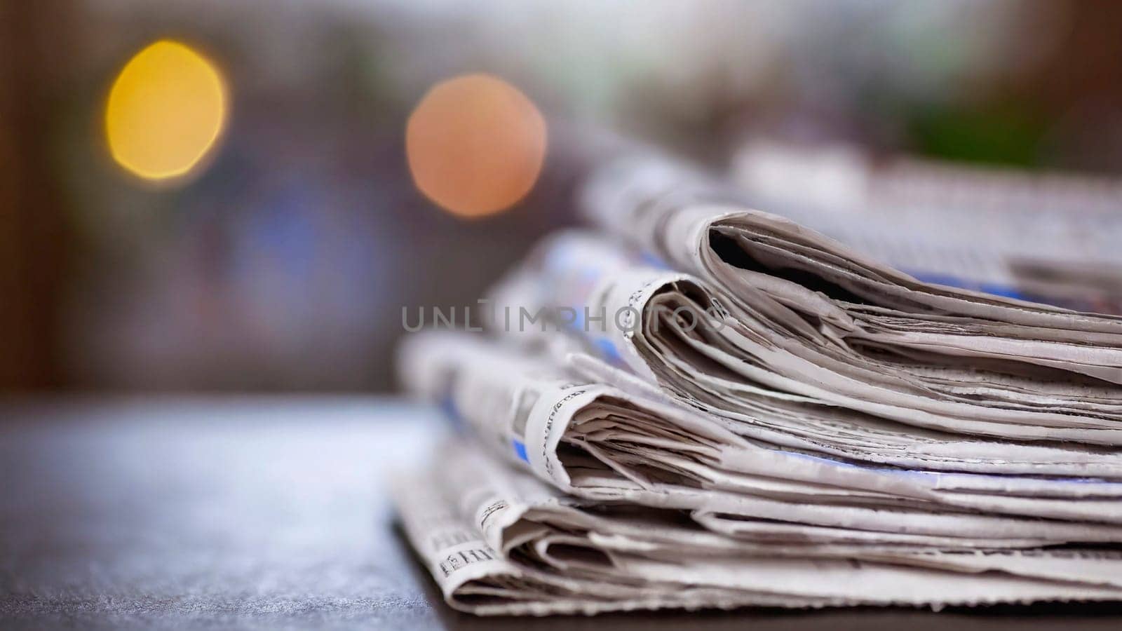 Stack of newspapers on the table in the morning light. Selective focus. Media news concept. AI generated