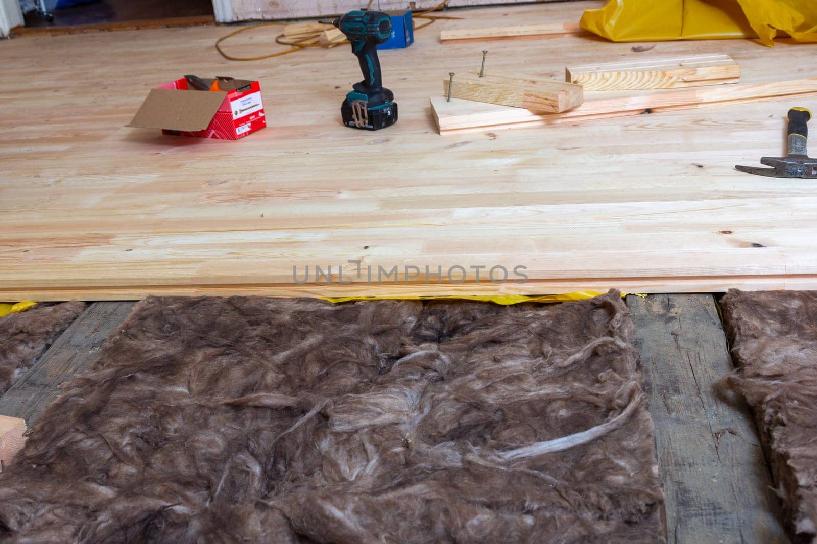 Creating a new wooden plank floor. House renovation