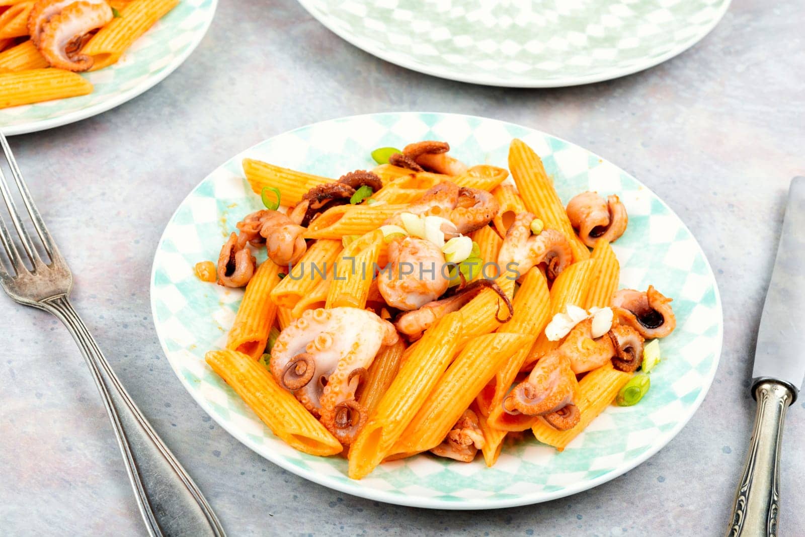 Delicious macaroni or pasta with octopus. Macaroni with seafood. American appetizer.