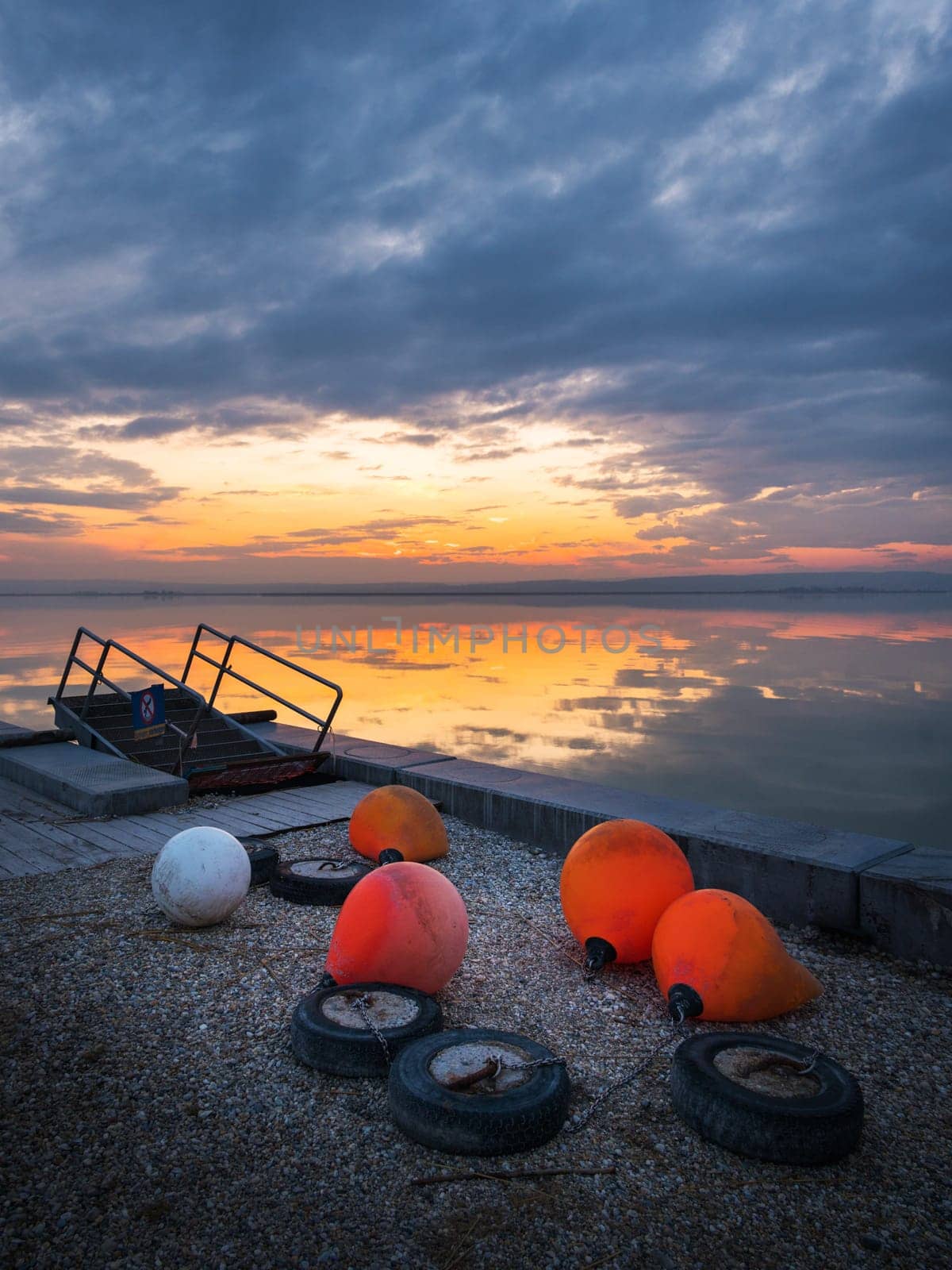lake neusiedlersee in burgenland sunset with buoys in foregraound