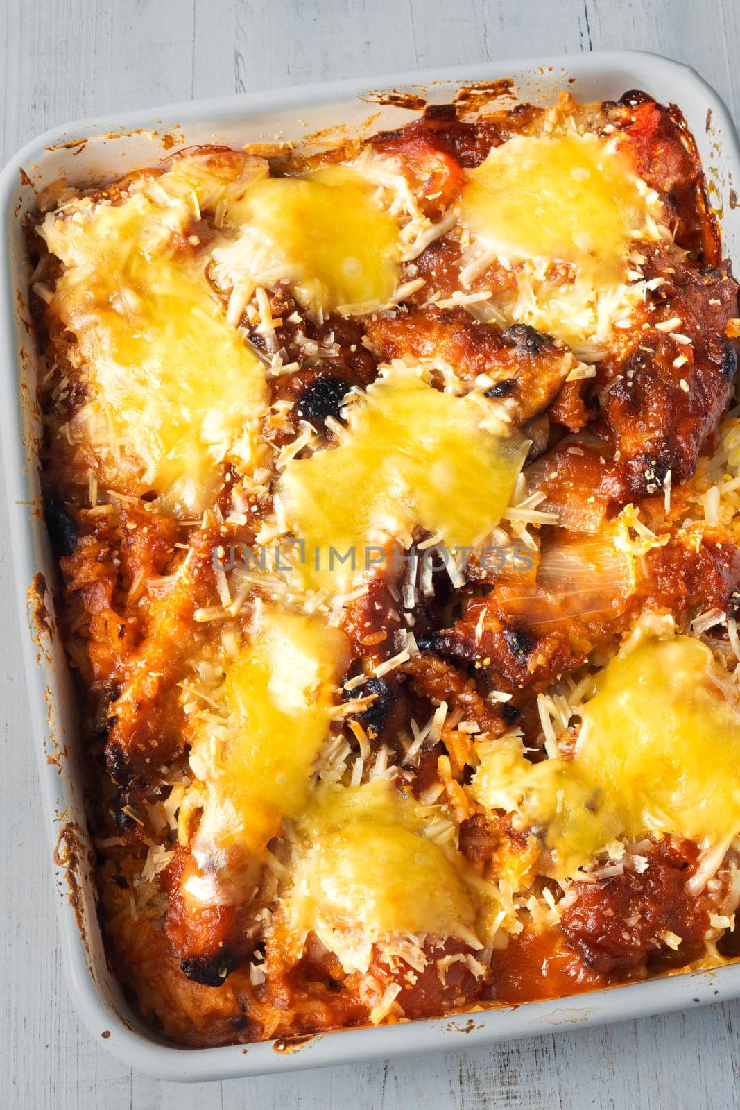 close up of a tray of hong kong style pork chop tomato baked rice
