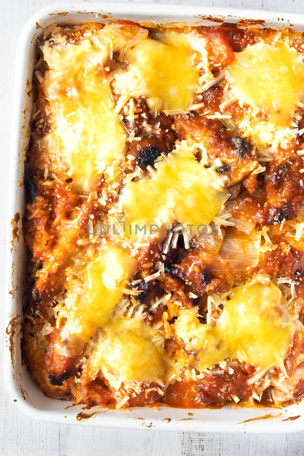 close up of a tray of hong kong style pork chop tomato baked rice