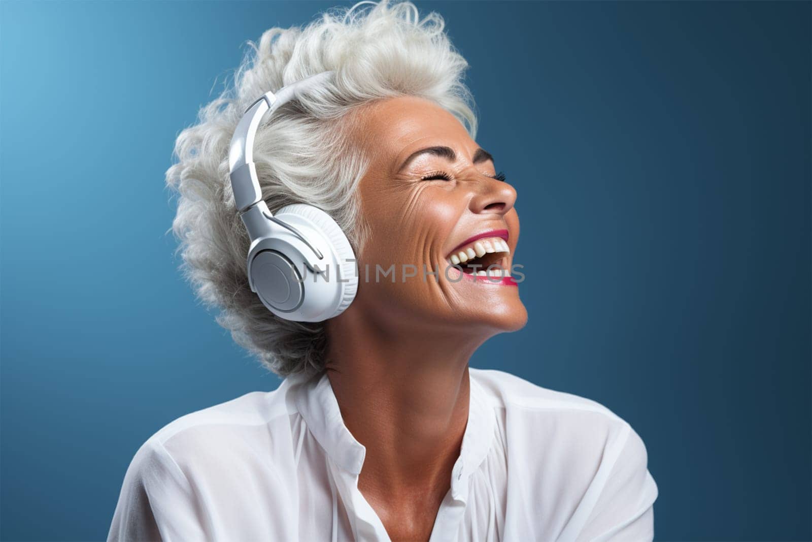 An elderly woman with white hair experiences pure joy while listening to music through white headphones.