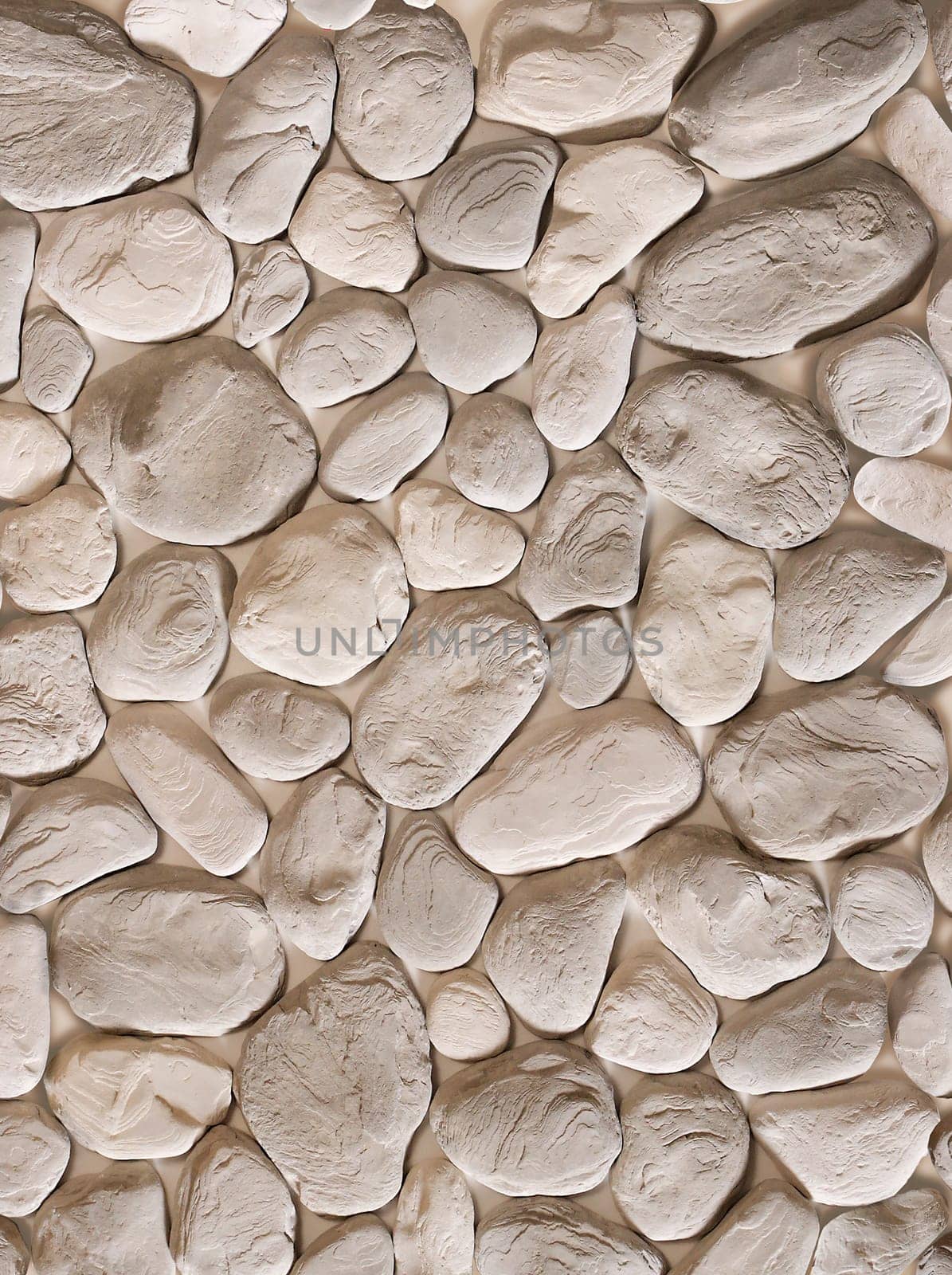 Decorative stone in the form of gray cobblestones of various shapes.Texture or background.