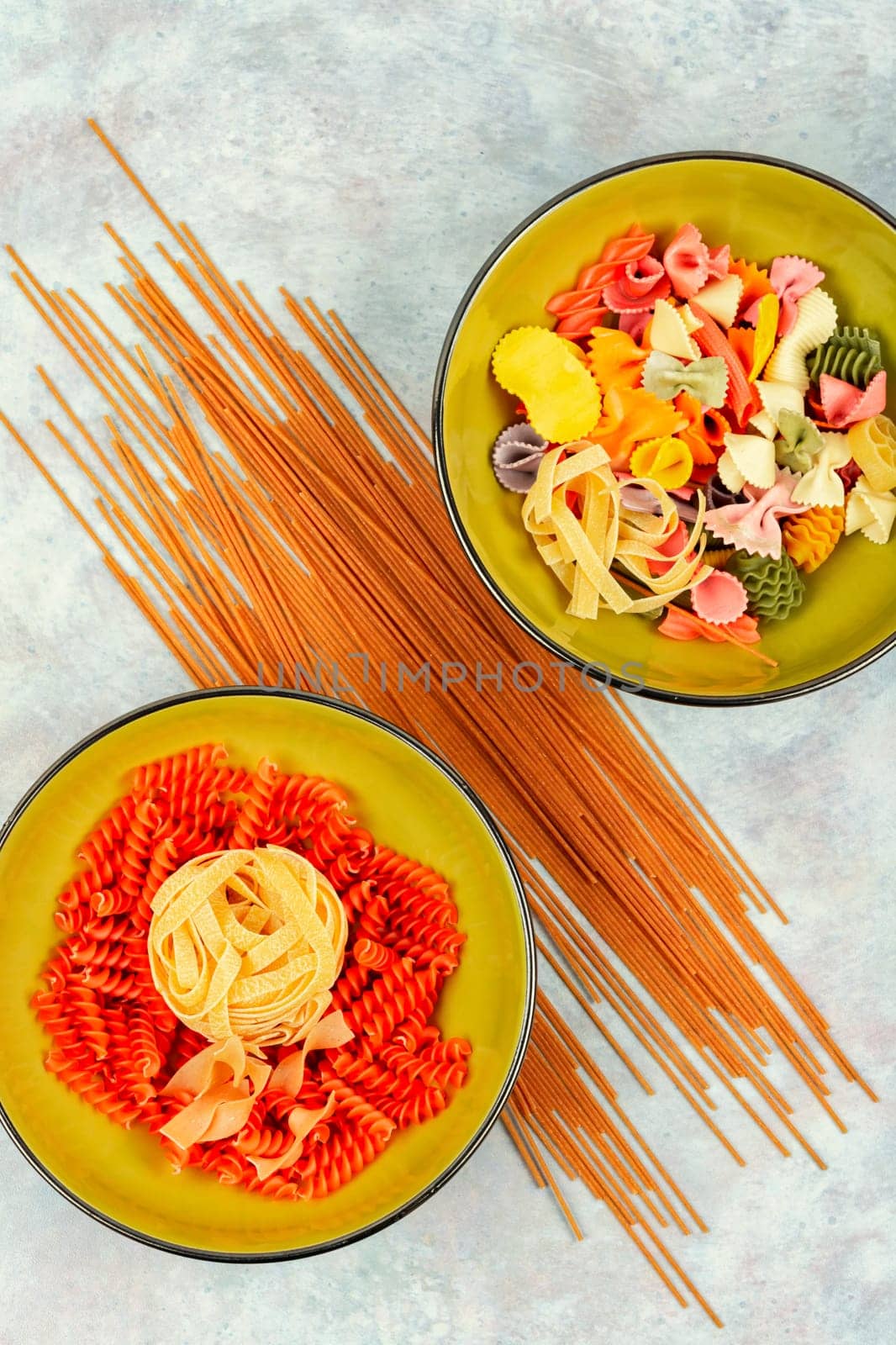 Different types and shapes of pasta, noodles and spaghetti. Top view with copy space