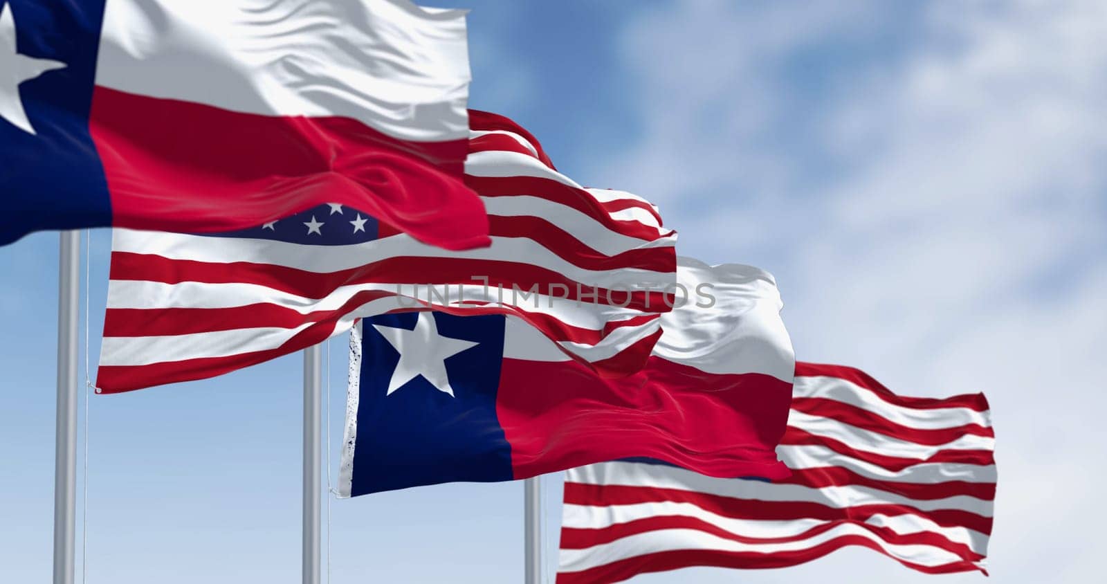 Texas state flags waving in the wind with american flags. Blue vertical stripe with white star, white and red horizontal stripes. 3D illustration render. Fluttering fabric background. Selective focus