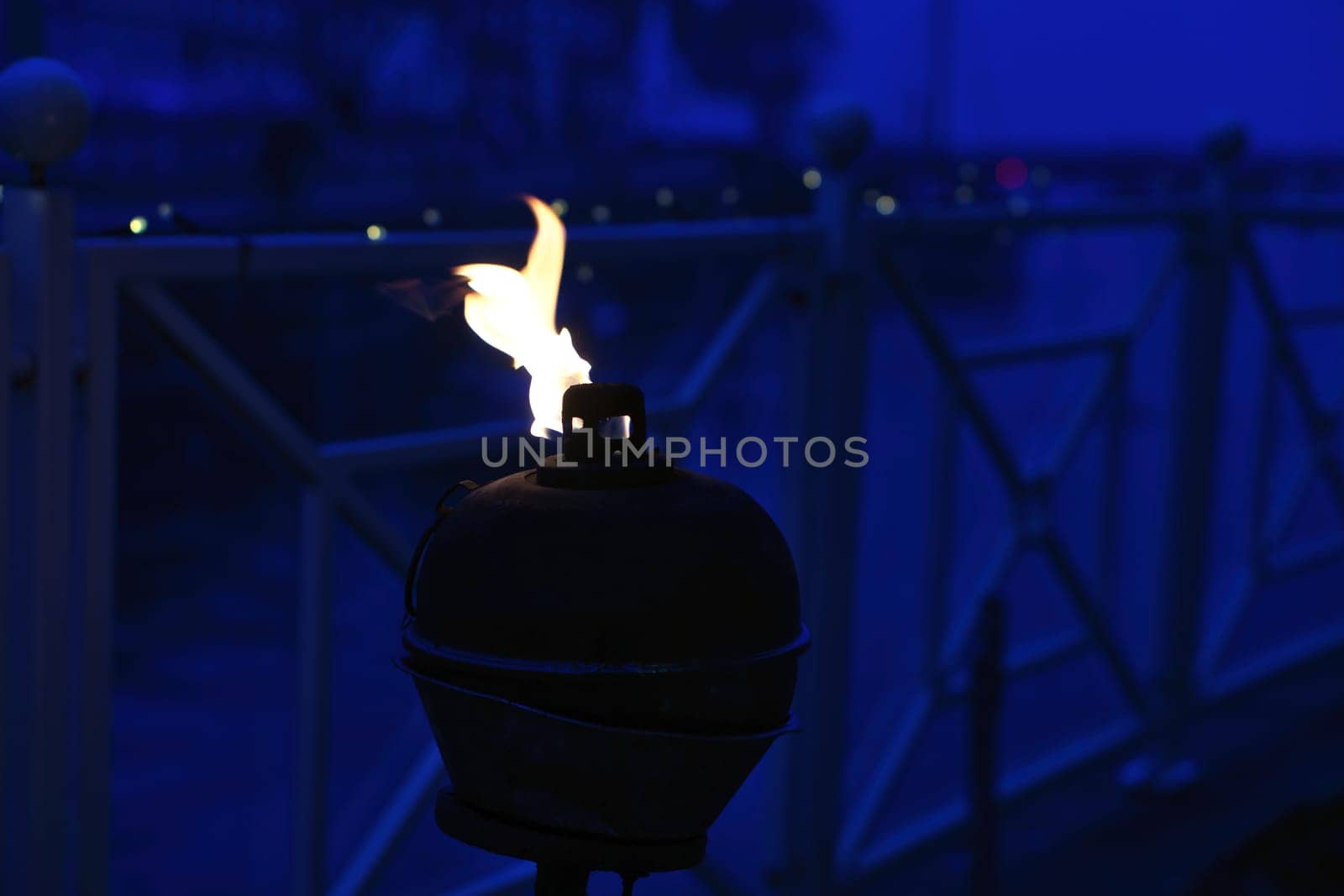 Burning oil lamp by the water in a relaxed atmosphere in Denmark. Still life