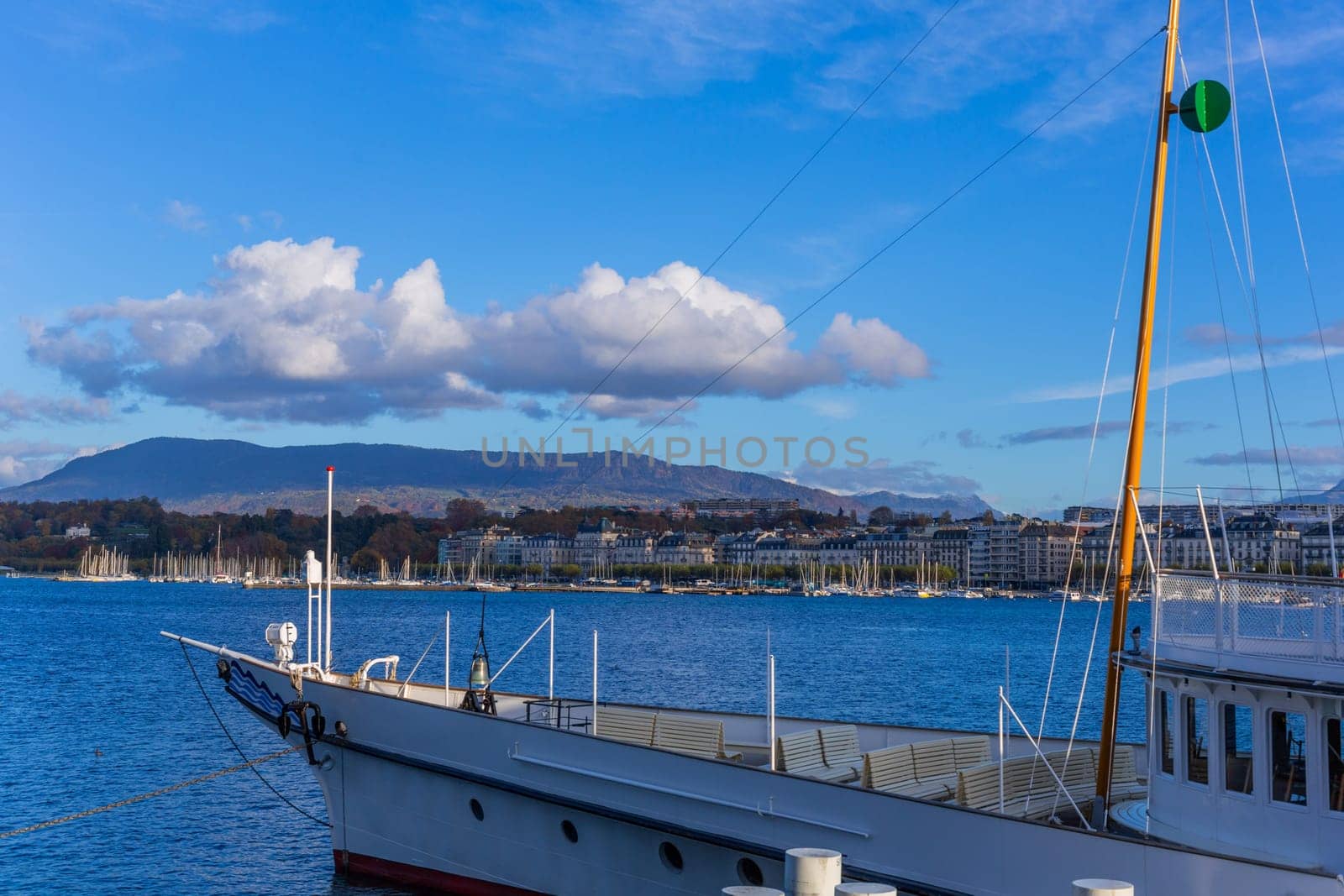 Geneva, Switzerland: November,15 2023: Boat on Lake Geneva. Lake Geneva iis a lake on the north side of the Alps, shared between Switzerland and France.