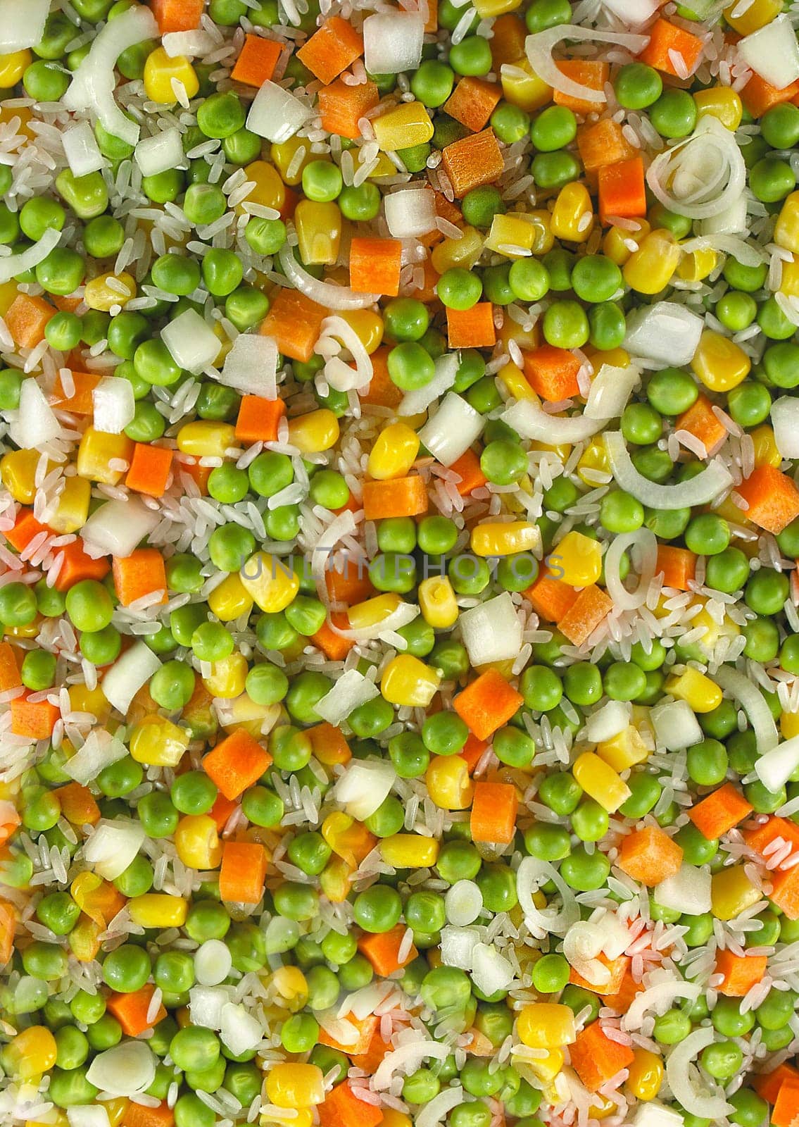 The finished ingredients of peas, corn and carrots for a vegetarian salad are a close-up view from above. Texture or background