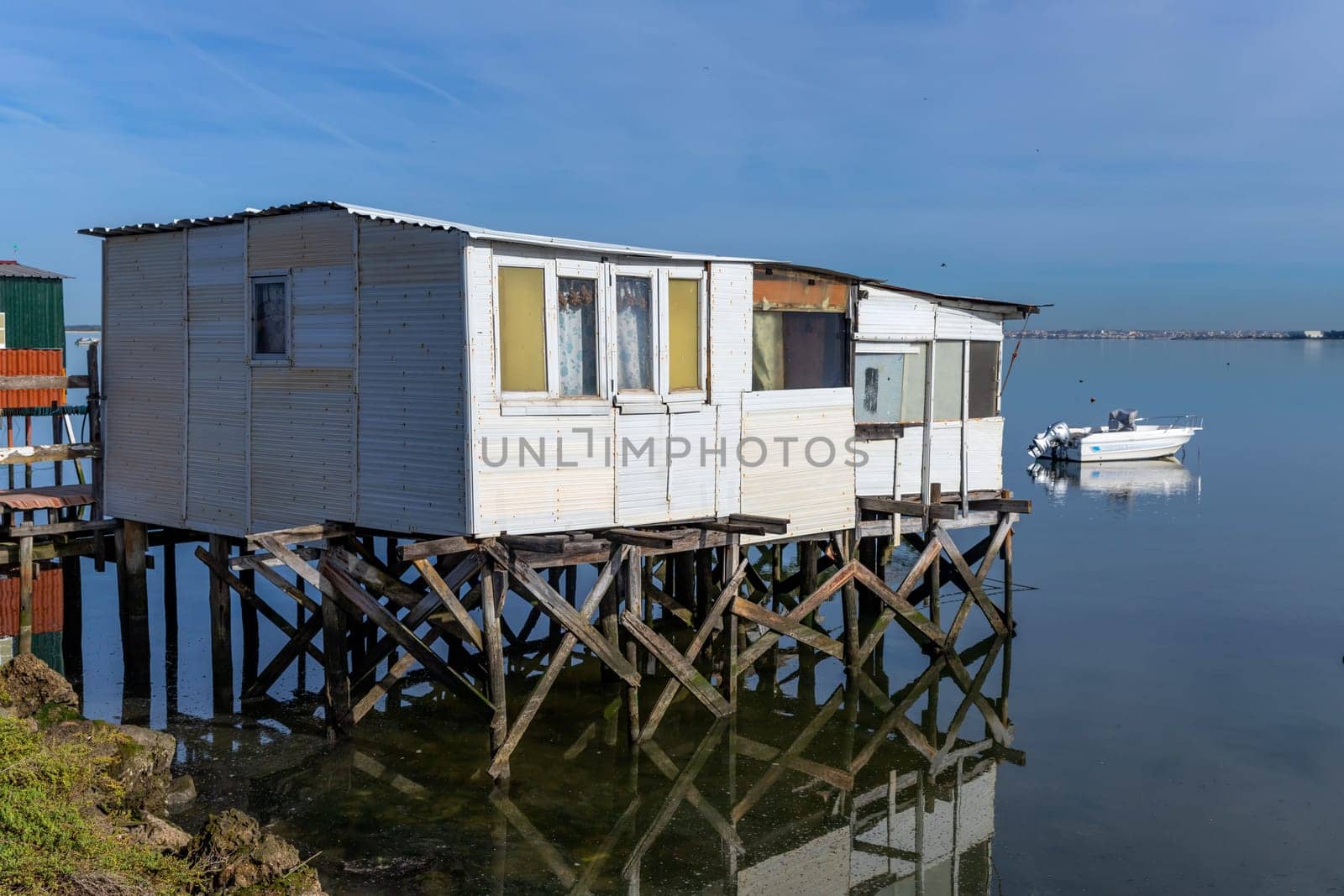 Seixal, Portugal: January 06, 2024: Wooden houses in Tagus river bank, near Seixal. Used by fishermen. Portugal