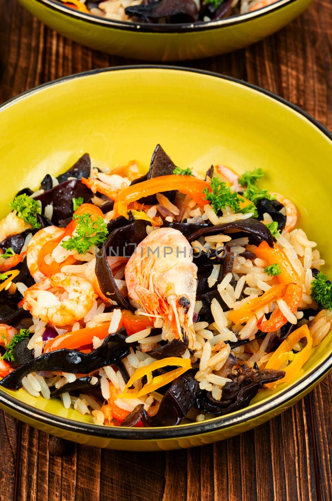 Shrimp fried rice serves on the dish. Healthy Asian meal.