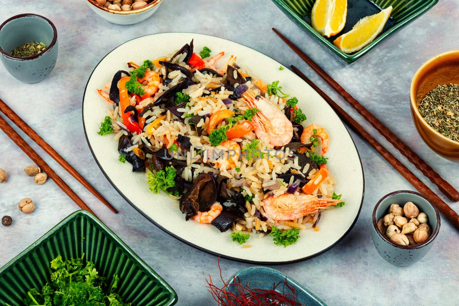 Shrimp fried rice serves on the dish. Healthy Asian meal.