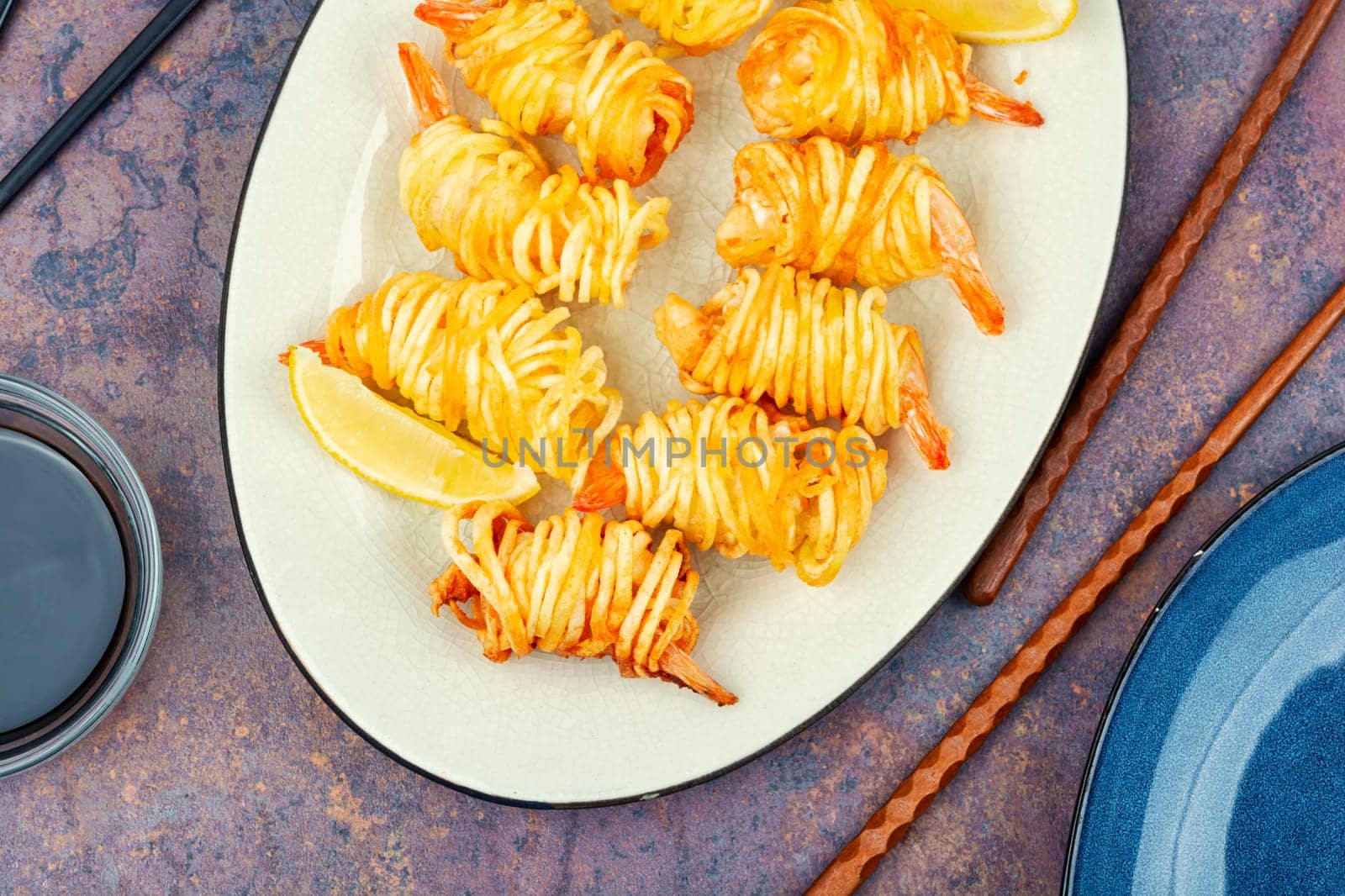 Fried rolled potato shrimps, prawns and potato rolls. Popular Asian food. Vietnamese cuisine.