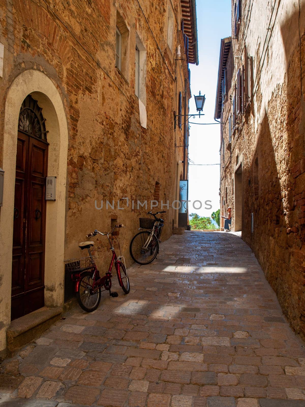 Pienza, Italy - Sept 12, 2022: Pienza, a tiny village in the Tuscany, known as the ideal city of the Renaissance and a capital of pecorino cheese. UNESCO World Heritage Site.