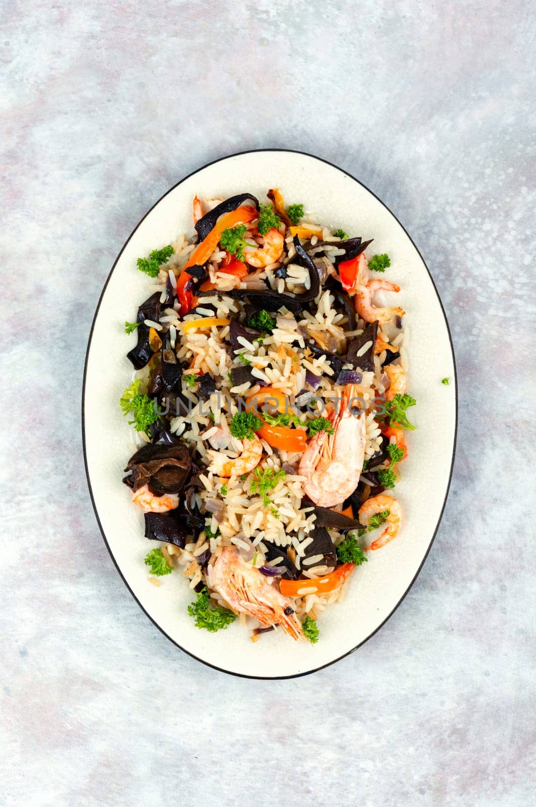Fried rice with shrimp and mushrooms. Homemade tasty Chinese food.