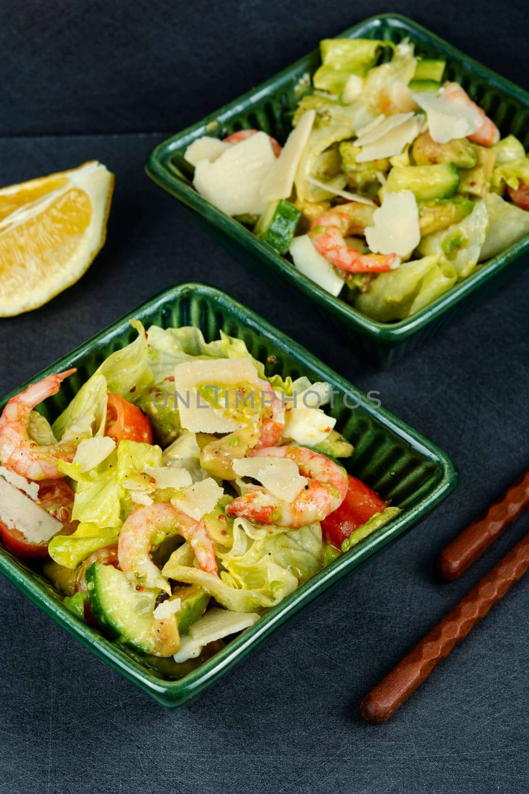 Asian salad with shrimps ,prawns avocado slices and tomato. Top view, close up.